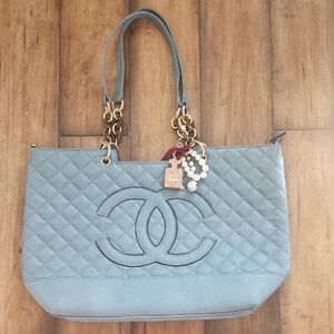 Elegant Blue Quilted Tote Bag with Gold Accents